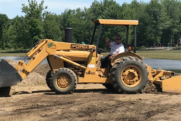 John A. Frate on tractor